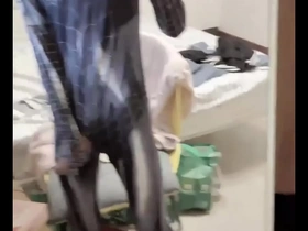 Young Asian man masturbates in a Spider-Man like manner.