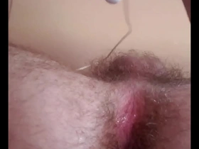 Young gay enjoys anal stimulation with his fingers and a vibrator.