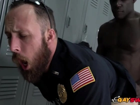 Gay police officers are assaulted by a sex hungry felon in the police station.