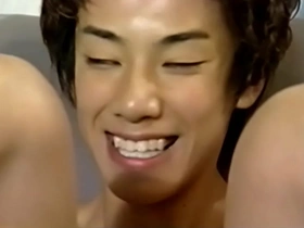 A young Japanese man gives a blowjob.