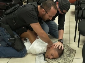 Gay officers from the Five O team raid a barbershop and arrest a black man in a rather kinky scene.